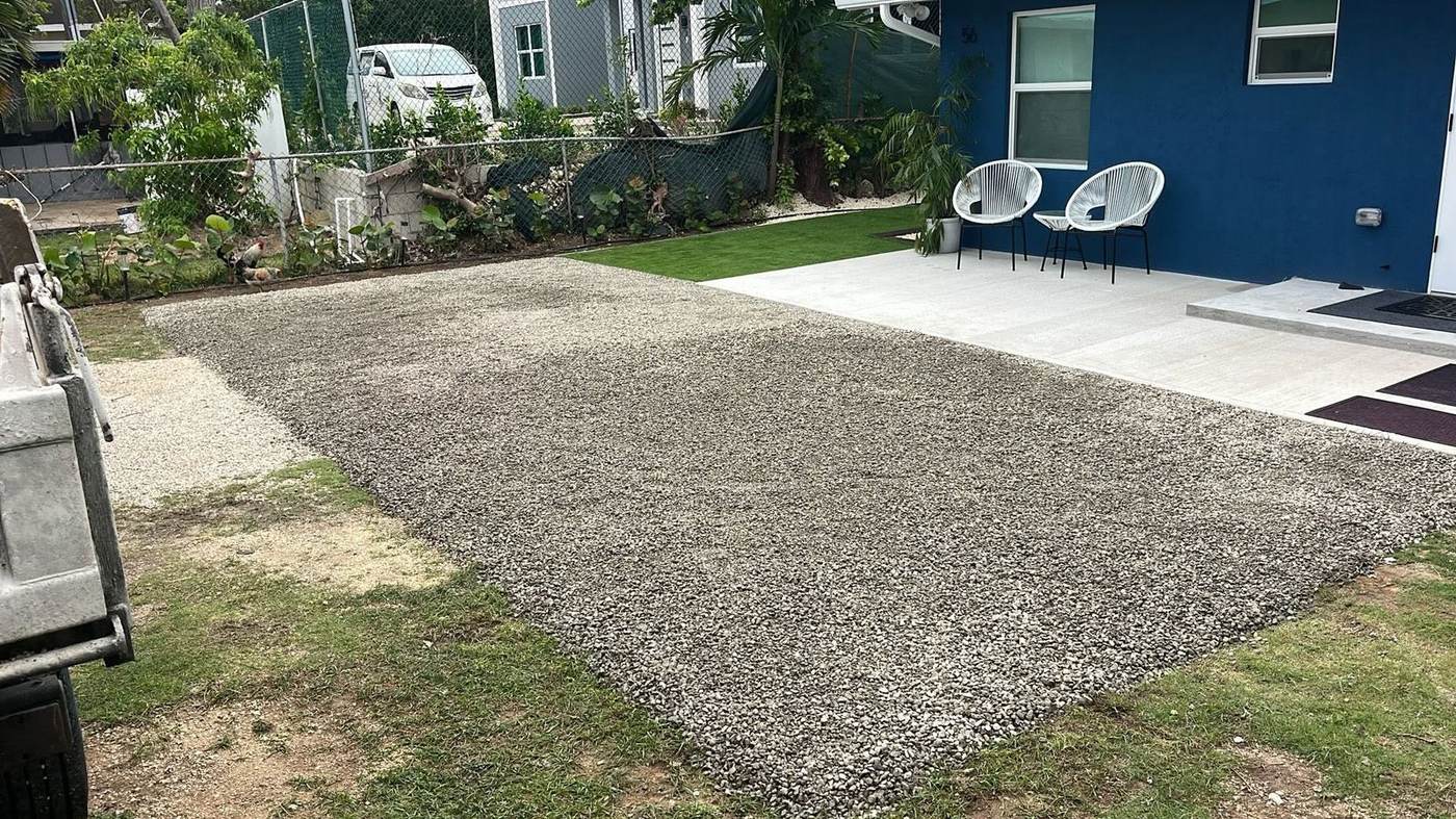Finished gravel driveway beside a Grand Cayman home