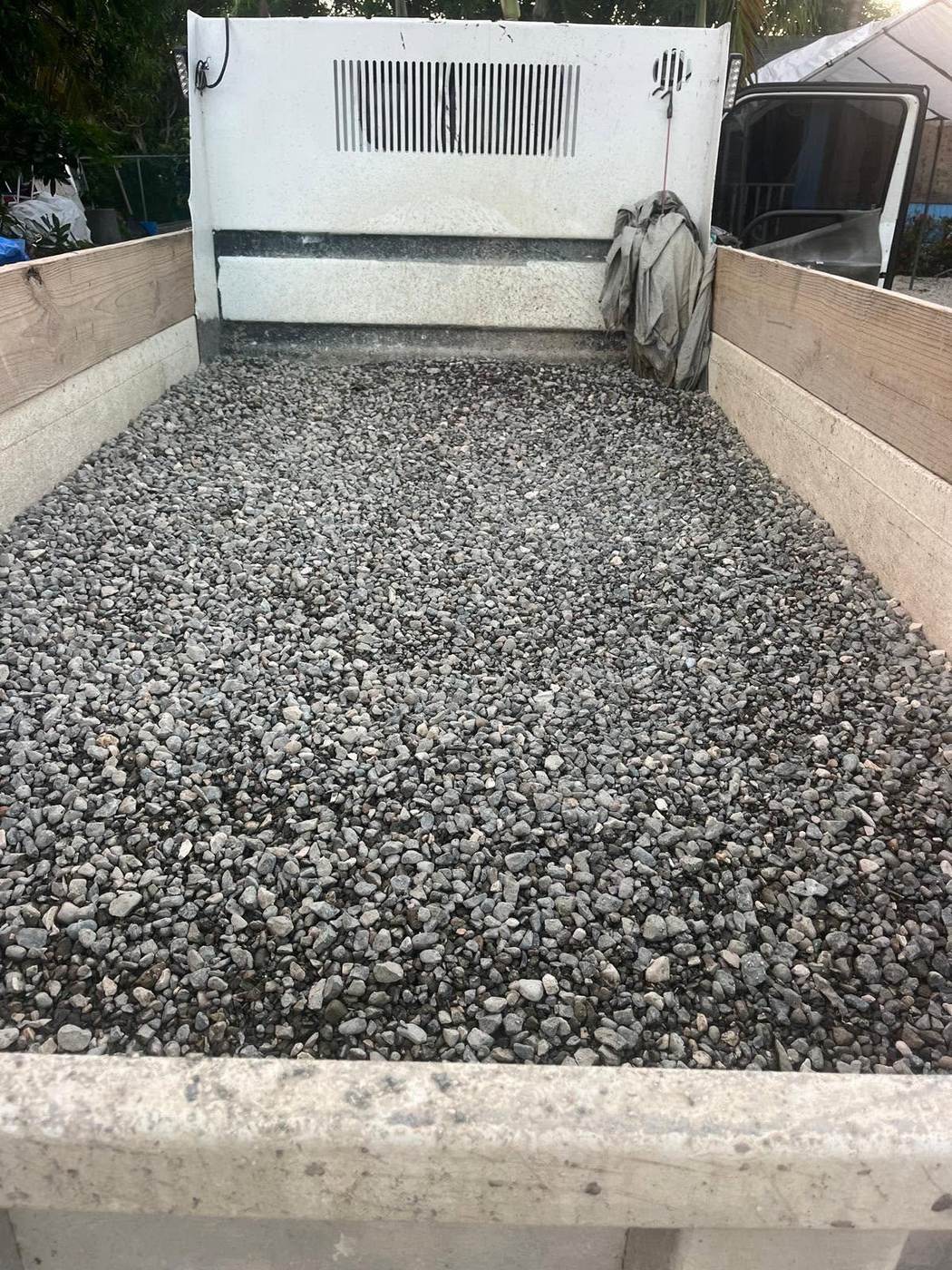 Truck bed loaded with gravel aggregate